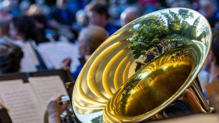 A tuba reflects the bandshell, the band and the audience at an Ashland City Band performances for this summer at Butler Bandshell in Lithia Park in 2023. Bob Palermini photo