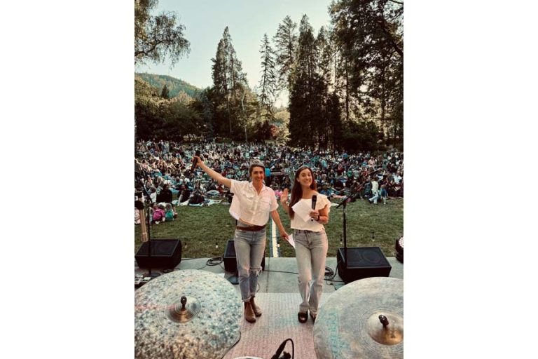 Jacqui Aubert, left, and Hanna Winters of the Ashland Folk Collective stand before a throng at the Summer Sounds concert at the bandshell in Lithia Park on June 17. The show, headlined by Sean Hayes, was the biggest in the collective's seven-year history. AFC photo
