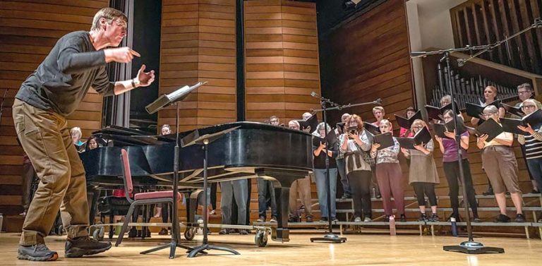 Music Director Paul French rehearses the Southern Oregon Repertory Singers for a concert at the SOU Music Recital Hall. Rep Singers photo