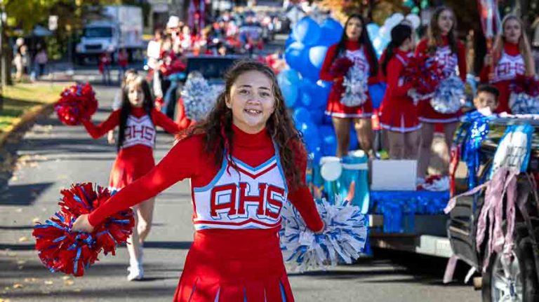 The Ashland High School cheerleaders including Peyton Nomura cheered their way up Main Street. Ashland.news photo by Bob Palermini