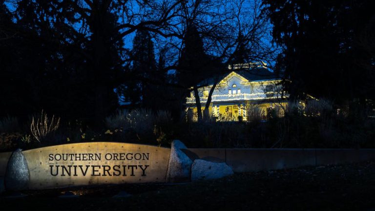 A sign at Siskiyou Boulevard and South Mountain Avenue marks one corner of the Southern Oregon University campus in December 2022. Visible in the background is the Plunkett Center. Ashland.news photo by Bob Palermini
