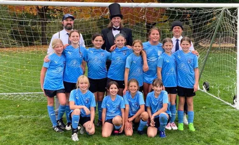 Back row, from left, Garrett Crowl, coach, Troy Hammell, and Adrien Malamitsas, coach. Middle row, Angeline Anderson, Marsha Anne Crowl, Hadley Kreunegel, Leia Atanes, Mae Phillips, Jo Catherine Collogne, Lennen Baldwin, and Montgomery Hammell. Front row, Riley Staten, Saoirse Downey, Brooklyn Malamitsas, and Raelin Schweizer. Contributed photo