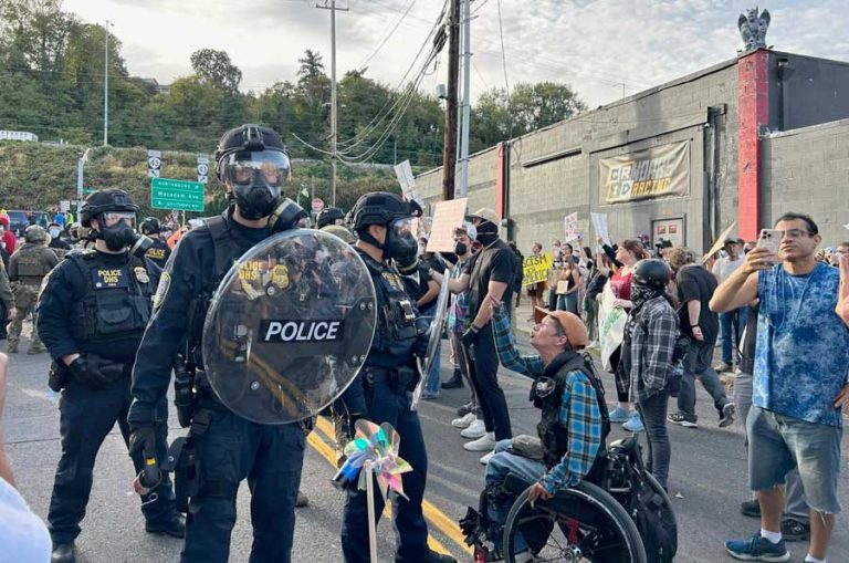 About 200 people showed up to protest outside the Immigration and Customs Enforcement building in Portland on Sunday, Sept. 28, 2025. The 9th Circuit Court of Appeals voted Tuesday, Oct. 28, to review a decision that cleared the way to deploy National Guard troops. Oregon Capital Chronicle photo by Alex Baumhardt