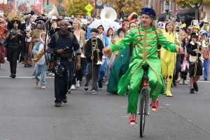 A unicyclist rides in the 2025 Ashland Halloween parade route. Dale Robinette photo