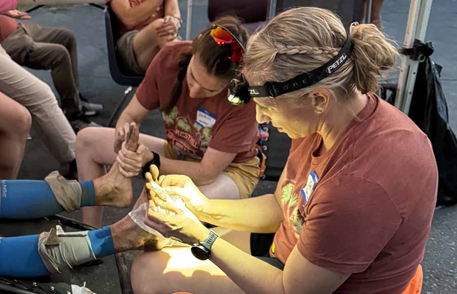 Kelly Lange, an Ashland chiropractor, works on an athlete during a sporting event. Lange was recognize nationally last month by the American Chiropractic Association Sports Council as its Chiropractor of the Year. Courtesy photo