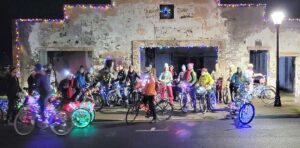 Participants at a prior Light on Bikes event. Photo courtesy of Talent Maker City