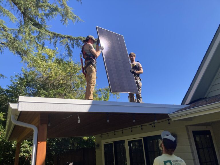 Contractors install solar panels on the roof of a house in Oregon. The mix of state, federal and private and nonprofit subsidies for solar panels have led to major growth in residential solar in the last decade, and today about 25,000 homeowners in Oregon are generating solar energy, according to the Oregon Energy Trust. Photo courtesy of Oregon Department of Energy