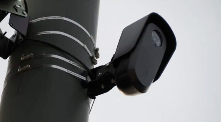 A Flock Safety license plate-reading camera is seen at Colfax Avenue and Franklin Street in Denver on Aug. 5. Colorado Newsline photo by Quentin Young