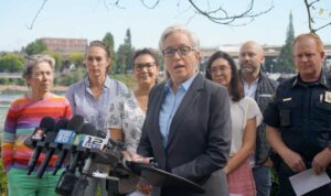 Gov. Tina Kotek stands with Portland leaders and Portland Police Chief Bob Day at a press conference in Portland, Oregon on Saturday, Sept. 27, 2025. She highlighted similar experience when announcing her 2026 bid for reelection on Thursday. Oregon Capital Chronicle photo by Alex Baumhardt